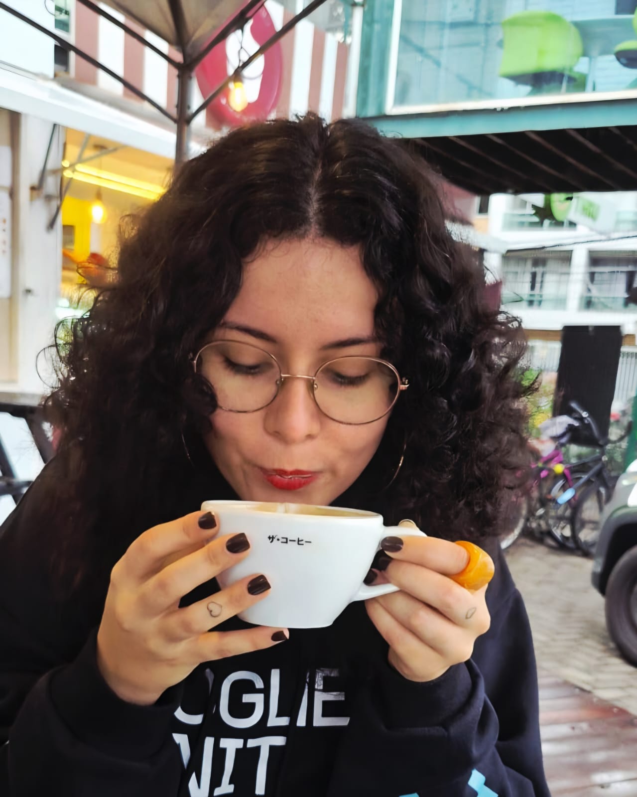 Photo of myself having a cup of coffe.